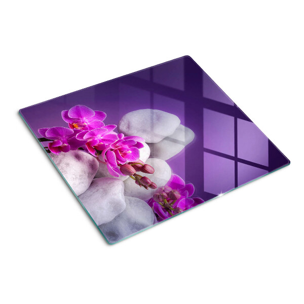 Deska kuchenna szklana Kwiaty orchidei na tle kamieni