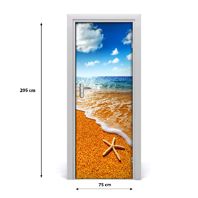 Naklejka DRZWI samoprzylepna Rozgwiazda na plaży