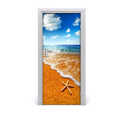 Naklejka DRZWI samoprzylepna Rozgwiazda na plaży