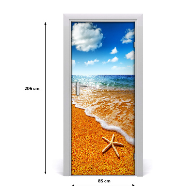 Naklejka DRZWI samoprzylepna Rozgwiazda na plaży