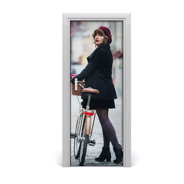 Fototapeta samoprzylepna DRZWI Kobieta na rowerze