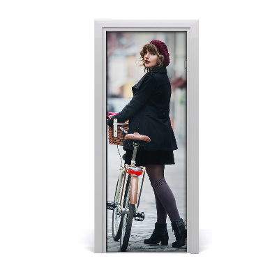 Fototapeta samoprzylepna DRZWI Kobieta na rowerze