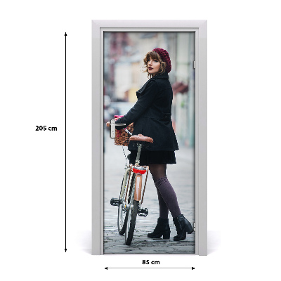 Fototapeta samoprzylepna DRZWI Kobieta na rowerze