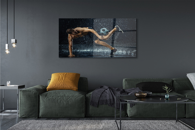 Obraz akrylowy Człowiek piłka deszcz