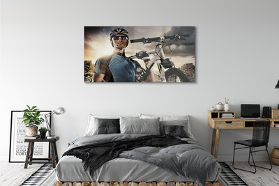 Obraz akrylowy Rowerzysta rower chmury