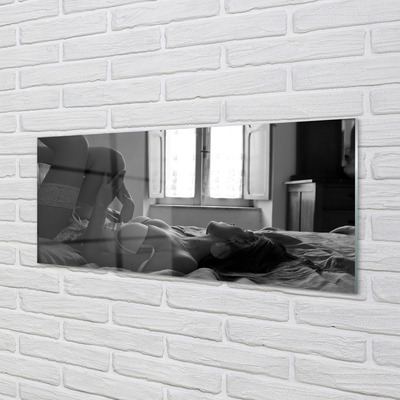 Obraz akrylowy Leżąca kobieta patrząca na okno