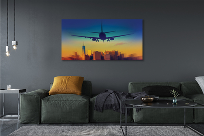 Obraz na płótnie Miasto chmury samolot zachód