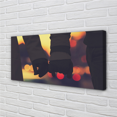 Zdjęcie na płótnie Dłonie w Blasku Świateł
