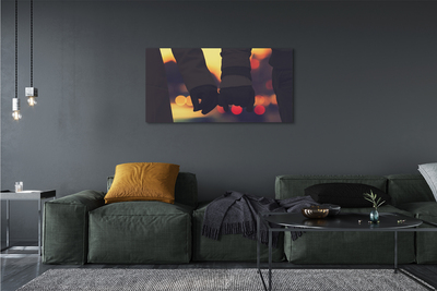 Zdjęcie na płótnie Dłonie w Blasku Świateł