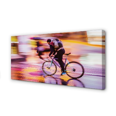Obraz canvas na ścianę Rowerzysta w Blasku Świateł