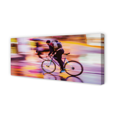 Obraz canvas na ścianę Rowerzysta w Blasku Świateł