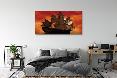 Obraz na płótnie Statek pomarańczowe niebo morze