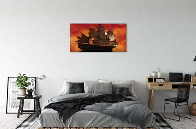 Obraz na płótnie Statek pomarańczowe niebo morze