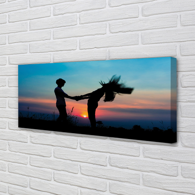 Fotoobraz na płótnie Ludzie na Tle Zachodu Nieba