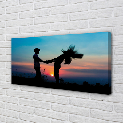 Fotoobraz na płótnie Ludzie na Tle Zachodu Nieba