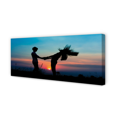 Fotoobraz na płótnie Ludzie na Tle Zachodu Nieba