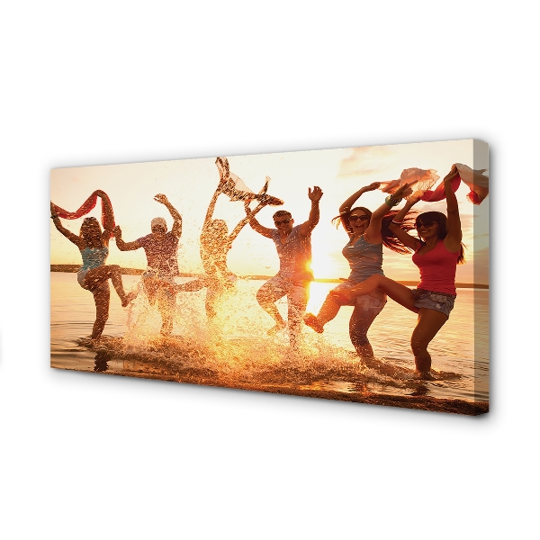 Obraz canvas na ścianę Ludzie nad Morzem o Zachodzie