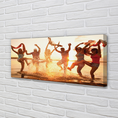 Obraz canvas na ścianę Ludzie nad Morzem o Zachodzie