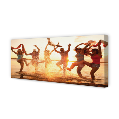 Obraz canvas na ścianę Ludzie nad Morzem o Zachodzie