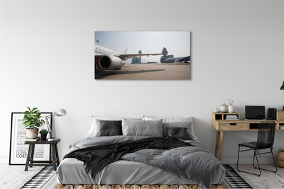 Obraz na płótnie Samolot budynki lotnisko niebo
