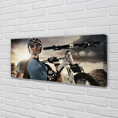 Obraz drukowany na płótnie Rowerzysta na Tle Chmur