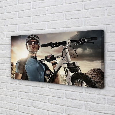 Obraz drukowany na płótnie Rowerzysta na Tle Chmur