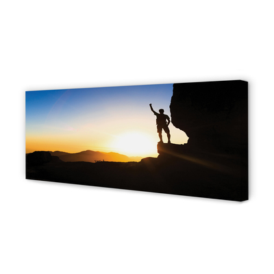 Obraz drukowany na płótnie Człowiek w Górach o Zachodzie