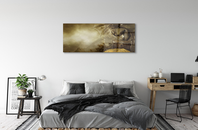 Obraz na szkle Smok góry chmury złoto