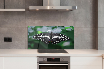 Panel Szklany Motyl na Zielonych Liściach