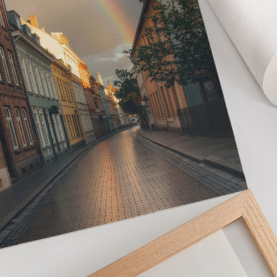 Plakat na płótnie Kolorowe kamienice tęcza pochmurne niebo