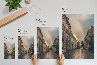 Plakat na płótnie kolorowe kamienice z tęczą na tle pochmurnego nieba