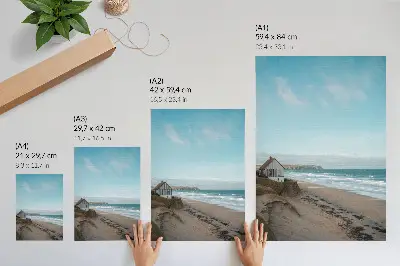 Plakat na płótnie plaża z falami i domem na klifie w pastelowych barwach
