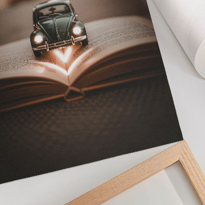 Plakat ścienny Miniaturowy samochód na książce magiczne światła
