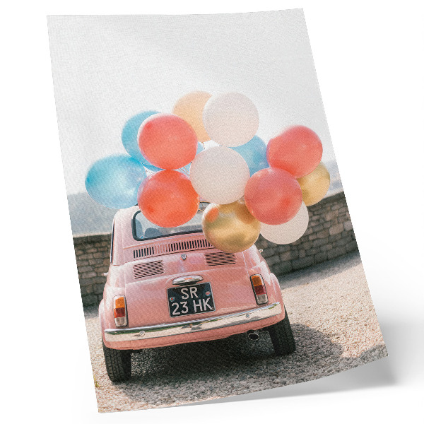 Plakat na płótnie Różowy samochód balony w tle retro