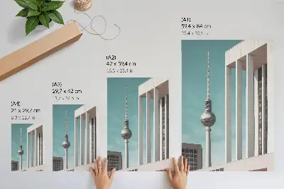 Plakat z teksturą płótna minimalistyczna wieża i nowoczesne budynki na tle błękitnego nieba