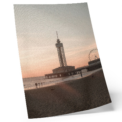 Plakat ścienny Plaża wieża pastelowe niebo koło widok