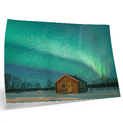Plakat do salonu Zorza polarnej nad zimowym domkiem