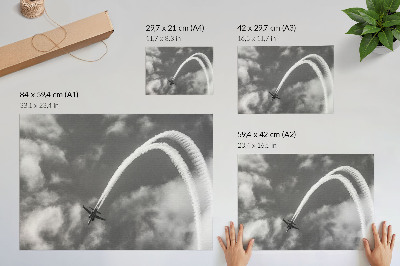 Grafika na ścianę Samolot na niebie dynamiczne smugi chmur