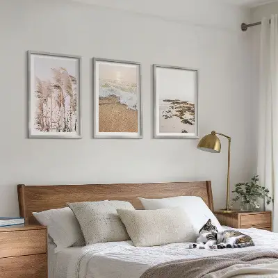 Zestaw 3 obrazów do salonu z plażowymi trawami, falami i kamieniami w stylu boho